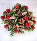 Holly Flower and Pine Cones in Glass Aquarium