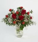 Holly Flower and Red Roses in Glass Vase