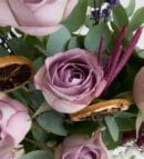 Lilac Roses in a Beige Vase