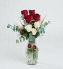 Red and White Roses in a Striped Glass Vase